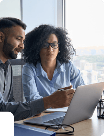 Two colleagues working together at a laptop