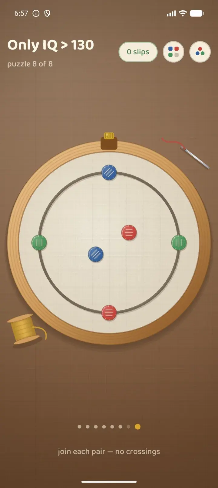 A puzzle on the embroidery hoop: six dots in three colours, waiting to be joined.